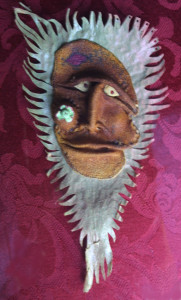 "Wind Man"   c. 2007  by Michael Whalton  mixed media, citrus leather, seeds and fish leather 10" x 5"  $2800