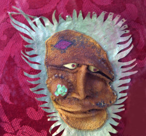 detail  "Wind Man"   c. 2007  by Michael Whalton  mixed media, citrus leather, seeds and fish leather 10" x 5"  $2800  #11283