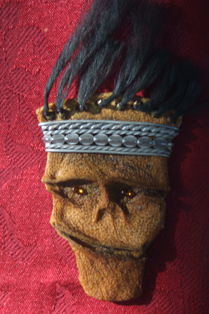 "Wind Hair Mask"   c. 2009  by Michael Whalton  citrus leather, mixed media,  European glass 6" x 3"  $2400   #11287 