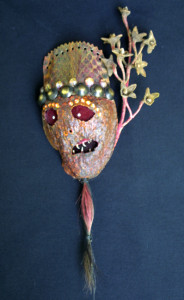 "Empress Mask"   c. 2011  by Michael Whalton  Painted Ox hair, viper leather, avacodo leather, flounder teeth, Empress sprig, European glass, brass  & diamonds   9" x 4"  $2800   #11295