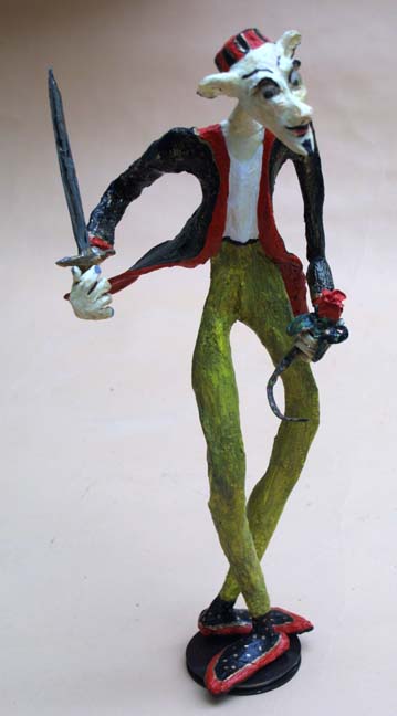 "Saboteur" 2008 by Hope Atkinson  (from Archetype series)  18" x 8" x 8"  acrylic on papier mache with found objects   $850  #9620
