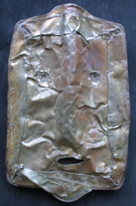 A metal sculpture of a face 3