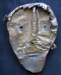 A metal sculpture of a face 2