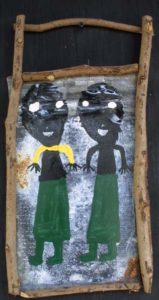 A painting of two persons in a wooden frame