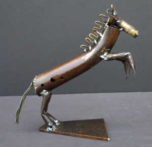 A small metal sculpture of a horse