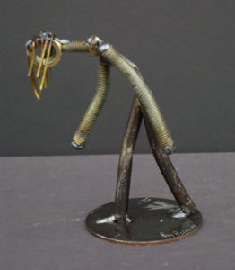 Metal sculpture of a person walking