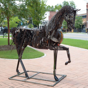 A big metal sculpture of a horse