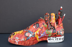 "Hell It Is- My Shoe" dated 2000 by Ronald Cooper acrylic, found objects, leather shoe 7" x 12.5" x 4.5" $350 #13102