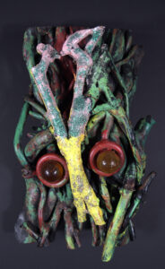 "Mask" dated 1992 by Bessie Harvey acrylic on wooden drift wood with found objects 20" x 13" x 7" $1000 #11510