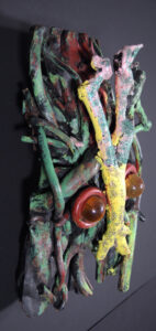 "Mask" dated 1992 by Bessie Harvey acrylic on wooden drift wood with found objects 20" x 13" x 7" $1000 #11510