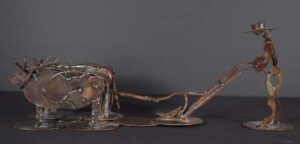 "Man Plowing with Ox Yoke" by Ray Bellew welded found metal 9" x 23" x 7" $700 #12761