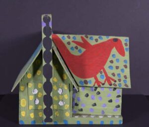 "Birdhouse with Girl and Birds" c. 1989 by Annie Tolliver house paint on handmade wooden birdhouse 12" x 12.5" x 15" $1800 #13380