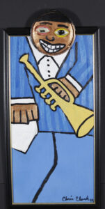 "Music Man" dated 1999 by Chris Clark acrylic on wood with found objects 27.75" x 13.5" small black frame $600 #13470
