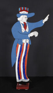 "Uncle Sam" by Howard Finster shaped painted wood on stand 22.5" x 11" x 4" $800 #13587