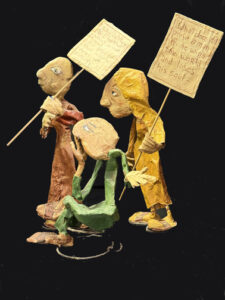 "Three Wisemen--Fools" c. 1991 by Hope Atkinson (3 figures with two signs)papier mache & paint with found metal spring tallest figure 7" $1400 #13734