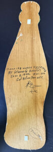 verso "Coke Bottle" #13,198  dated Jan 8, 1990 by Howard Finster  paint, marker on wooden cut out  34" x 10.5" x 1/4"   $400