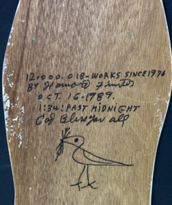 Verso detail "Coke Bottle" #12,018 dated Oct. 16, 1989 by Howard Finster enamel, marker on wood cutout 34" x 10.5" $6000 #12108 Provenance Wiregrass Museum Exhibition